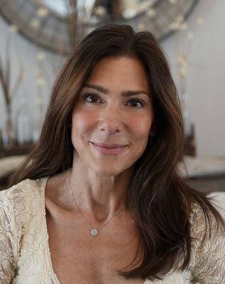 Portrait of Jodi Serapilia, Real Estate Advisor.
